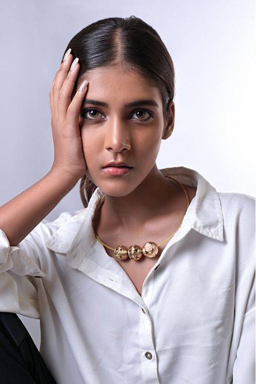 Women wearing handmade brass jewellery